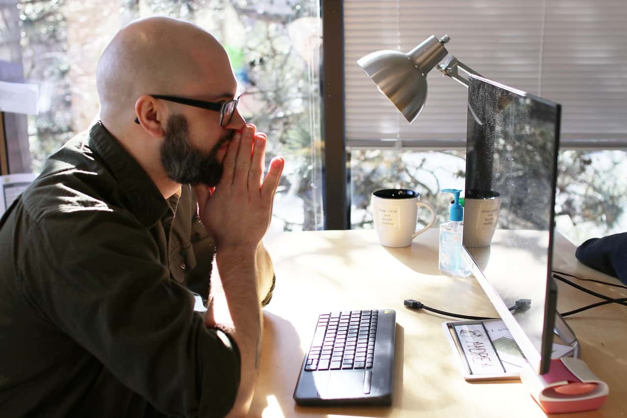 man-looking-at-computer-screen-intently