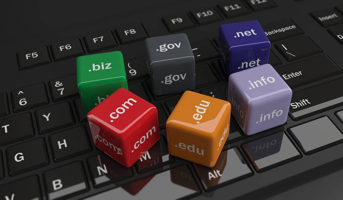 Colorful cubes with domain name extensions on a computer keyboard